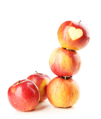 Red apple with heart isolated on white