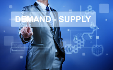Business man with digital screen press on button demand-supply