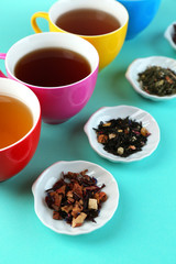 Assortment of tea on color background