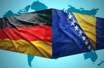 Waving Bosnian and German flags