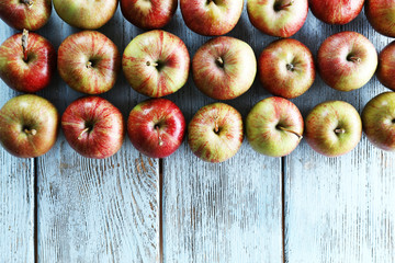Juicy apples on wooden table, close-up