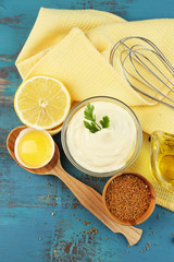 Mayonnaise ingredients on wooden background