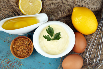 Mayonnaise ingredients on wooden background