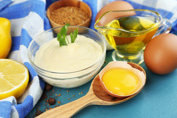 Mayonnaise ingredients on wooden background