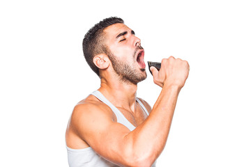 young handsome man singing at his trimmer