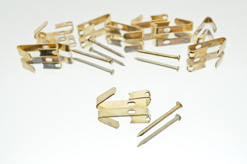 Collection Of Small Lying Metal Picture Hooks With Brads / Nails