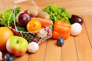Fresh organic fruits and vegetables in wicker basket