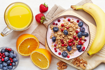 Healthy breakfast. Yogurt with granola and berries - Powered by Adobe