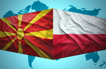 Waving Macedonian and Polish flags