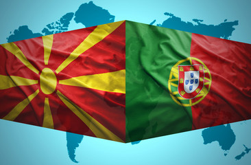 Waving Macedonian and Portuguese flags