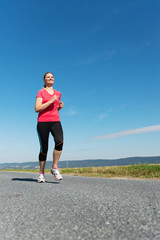 Erwachsene Frau beim Joggen