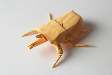 Orange origami bug