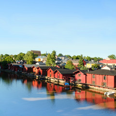 Fototapeta na wymiar Porvoo, Finland. Old wooden red houses on the riverside