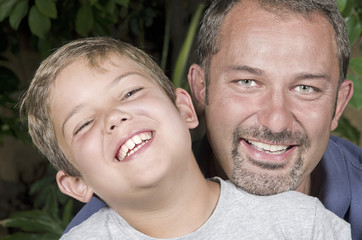 Fototapeta premium Portrait of a happy father with his little son