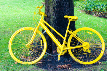Yellow bicycle exposed on York city walls, England