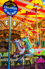 View of Carousel with horses on a carnival Merry Go Round