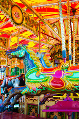 Fototapeta na wymiar View of Carousel with horses on a carnival Merry Go Round