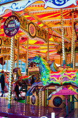Fototapeta premium View of Carousel with horses on a carnival Merry Go Round
