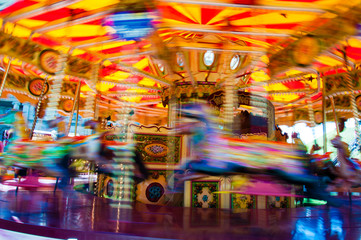 View of Carousel with horses on a carnival Merry Go Round