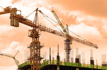 Crane and workers at construction site