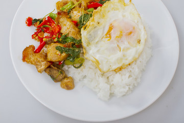 Fried basil leave with crisp pork on rice and fried egg