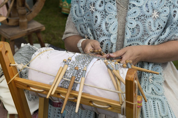 Fototapeta na wymiar Bobbin lace weaving