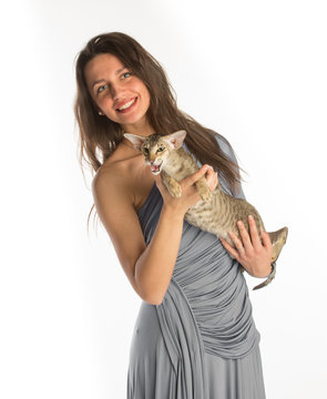 Pretty girl in night dress with cat, isolated in white