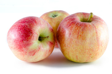 three ripe apples isolated on white background