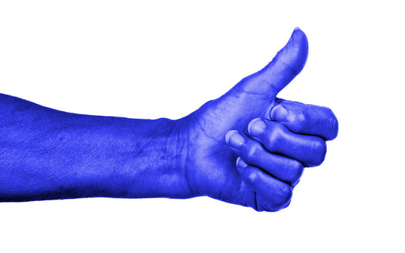 Old woman with arthritis giving the thumbs up sign