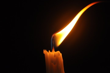 Close Up Candle With Creative Flame Over Dark Background (Noise 