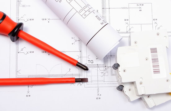 Diagrams, electric fuse and screwdrivers on construction drawing