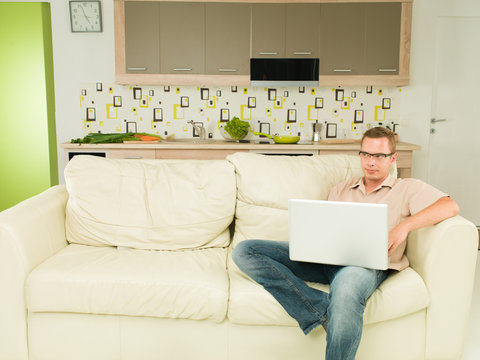 Man Reading Something On Laptop