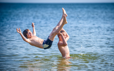 brothers are enjoying the clear warm water