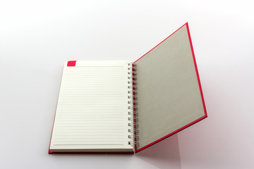 Open red book with lines.