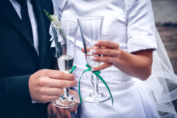 Bride and groom with glasses of champagne