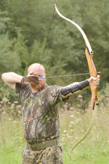 Young archer training with the bow 