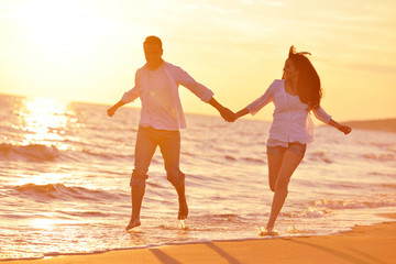 young couple  on beach have fun