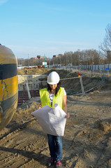 Young female architect at the construction site of the construct