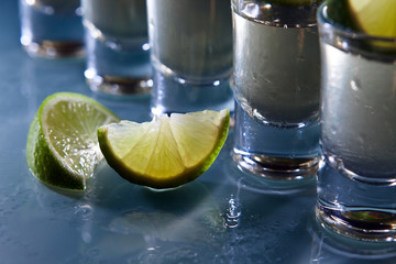 tequila and lime on glass table