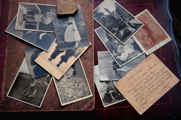 Old photos and letter on brown background.