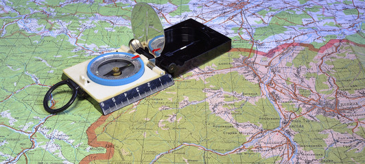 tourist's compass at travell map