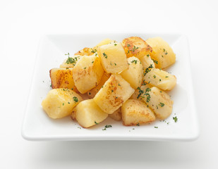 Fried potatoes on white plate