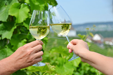Pair of wineglasses against vineyards in Rheinau, Switzerland