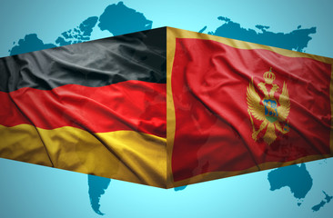 Waving Montenegrin and German flags