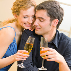 Cheerful couple with champagne