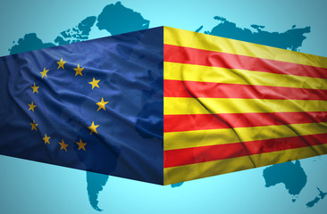 Waving Catalonia and European Union flags