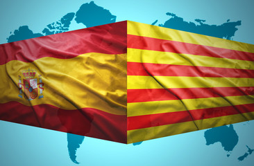 Waving Catalonia and Spanish flags