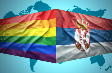 Waving Serbian and Gay flags