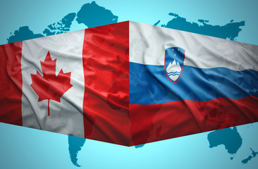 Waving Slovenian and Canadian flags