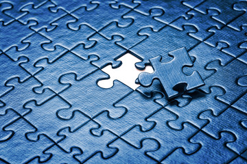 Puzzle with missing piece.